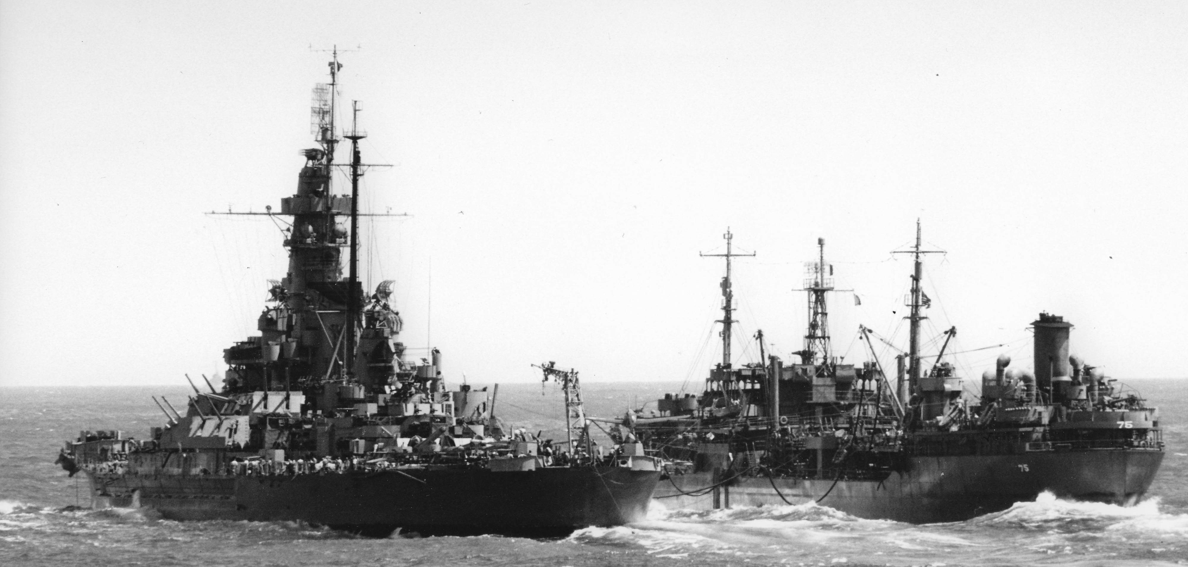 USS Massachusetts BB-59 refueling from fleet oiler Saugatuck AO-75, 20 April 1945, photographed from USS Hornet CV-12