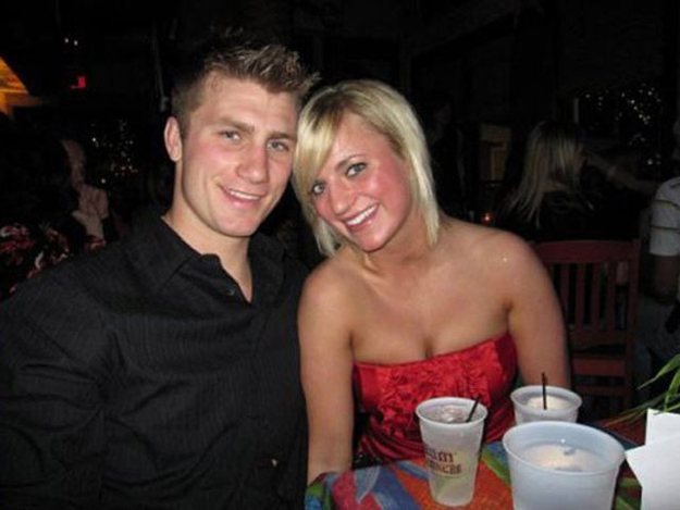 Taylor Morris and his girlfriend at a restaurant table, before the deployment
