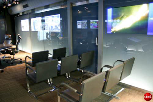 Extra seating area in the Navy Command Center of the Future arranged for junior staff alongside senior decision makers