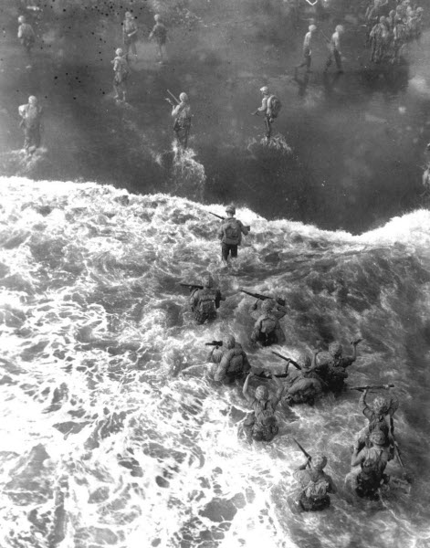 US Marines wade through rough water to take beach at Cape Gloucester New Britain December 1943
