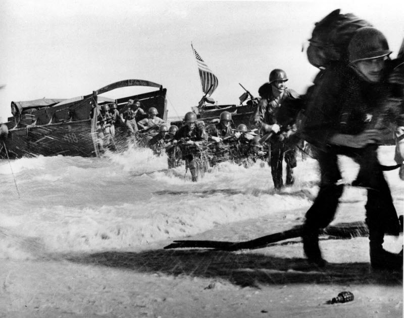 US infantrymen leave Higgins boats and race for beach at Wakde Island Dutch New Guinea May 1944