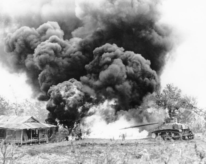 US Marine flame throwing tank attacks Japanese pillbox during invasion of Saipan November 1944
