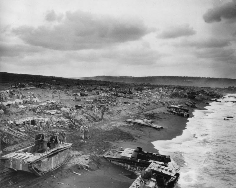 Amtracs bogged down in sands along beaches of Iwo Jima after American invasion February 1945