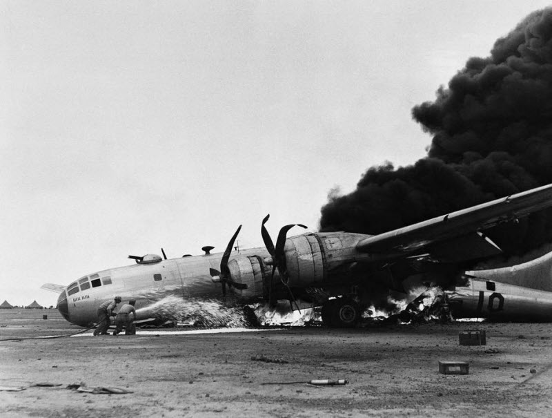B-29 burns after emergency landing on Iwo Jima returning from raid on Japanese mainland July 1945
