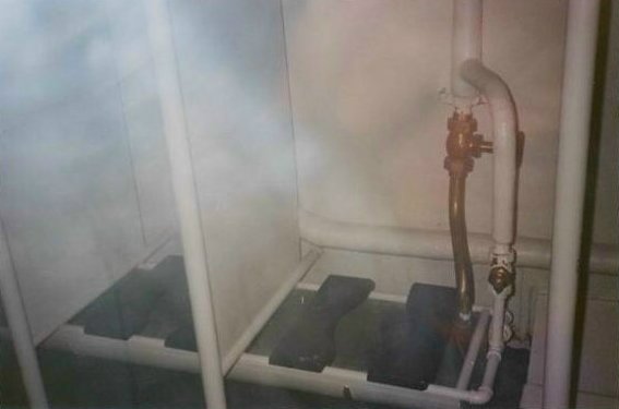 U.S. Navy shipboard head — open trough toilet system